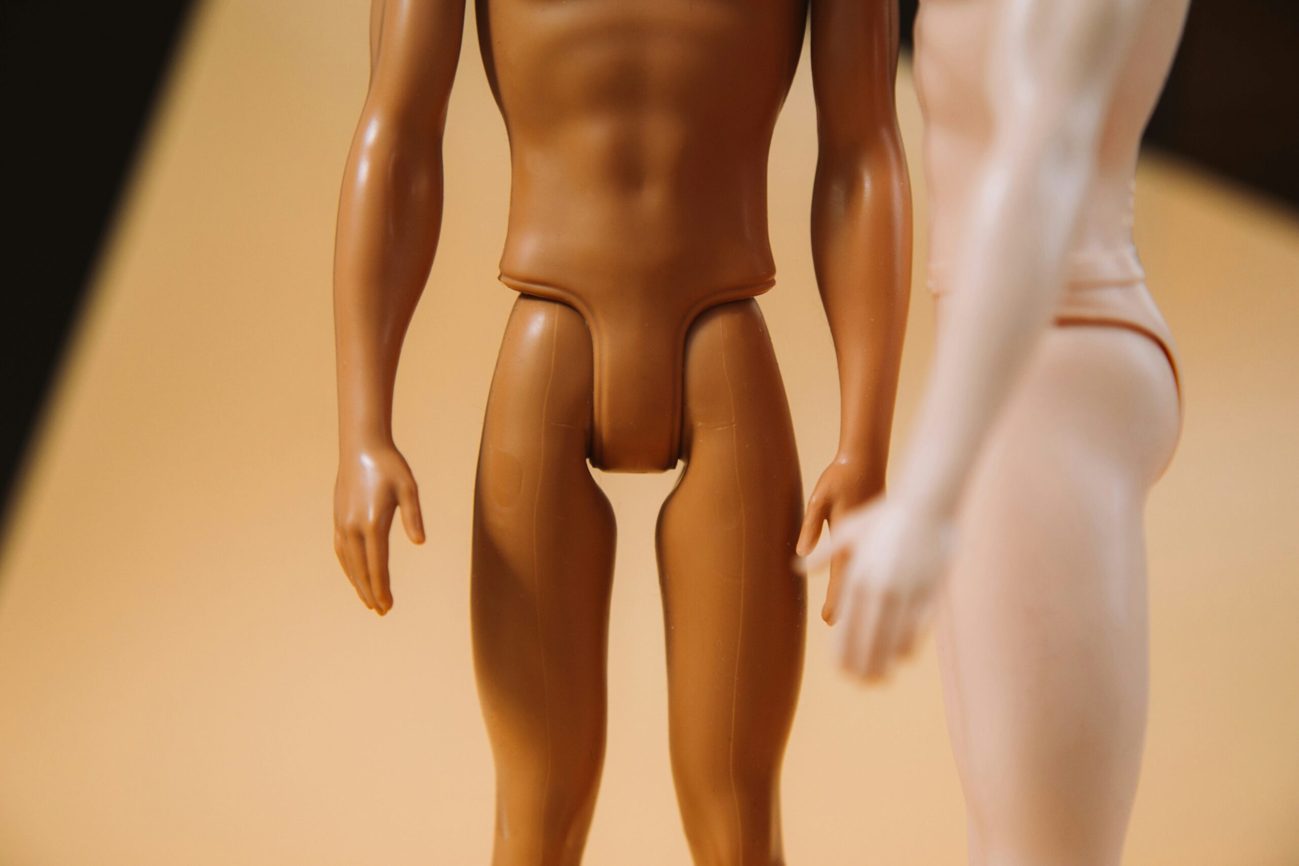 two plastic male dolls