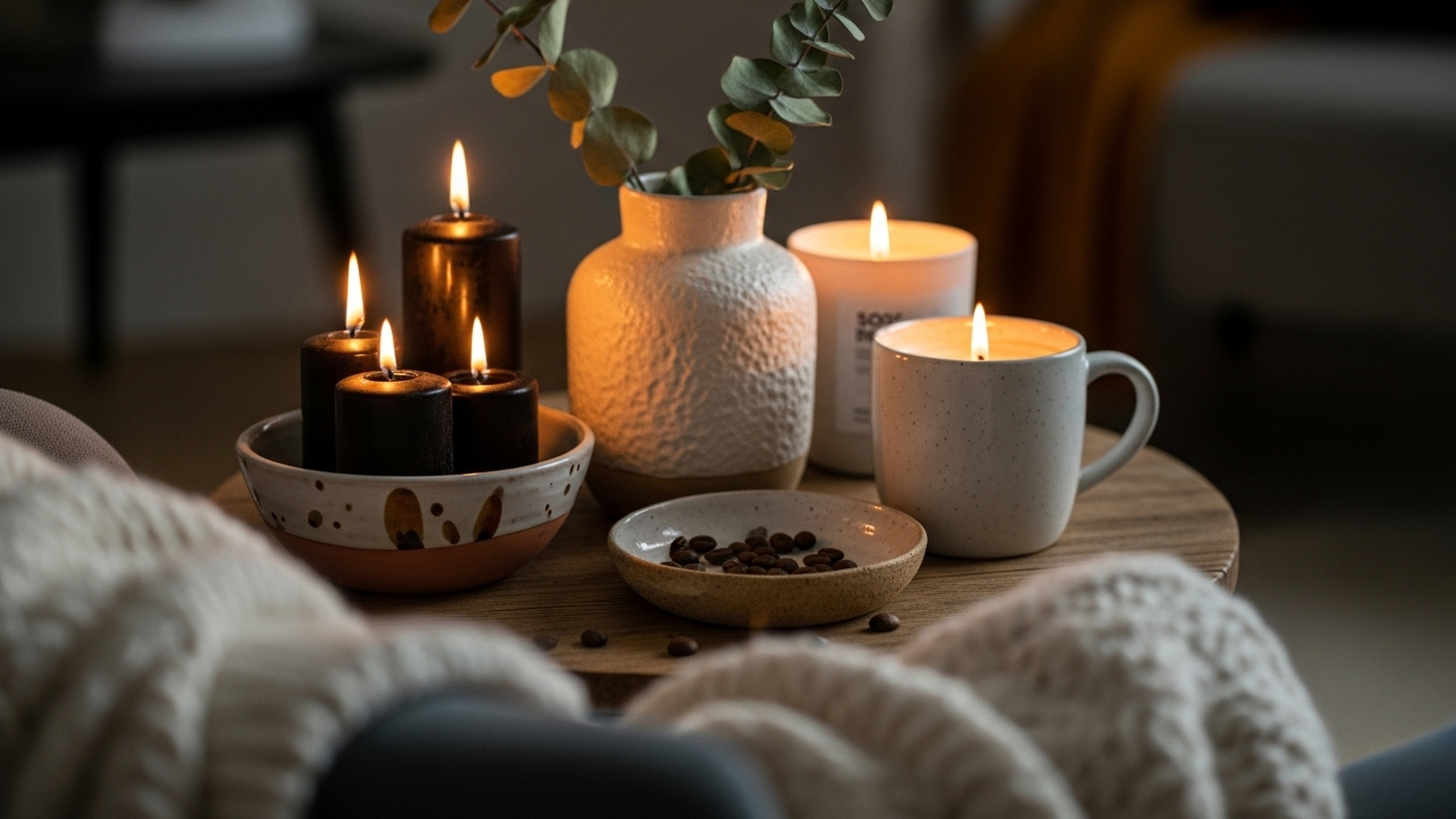 A calm indoor setting with lit candles, soft textures, and warm lighting, representing safety, comfort, and emotional regulation